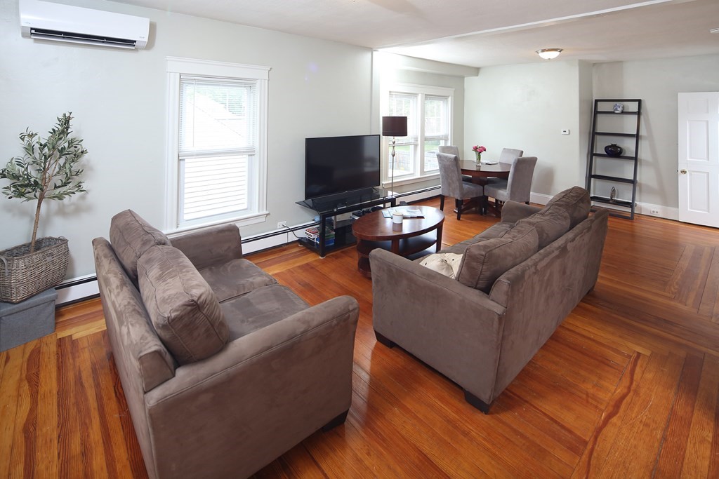 137 Mendon Road Attleboro, MA 02703 - Photo 3 of 24 a living room with furniture and a flat screen tv