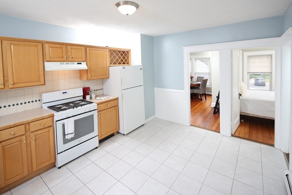 137 Mendon Road Attleboro, MA 02703 - Photo 6 of 24 a kitchen with a stove and a refrigerator