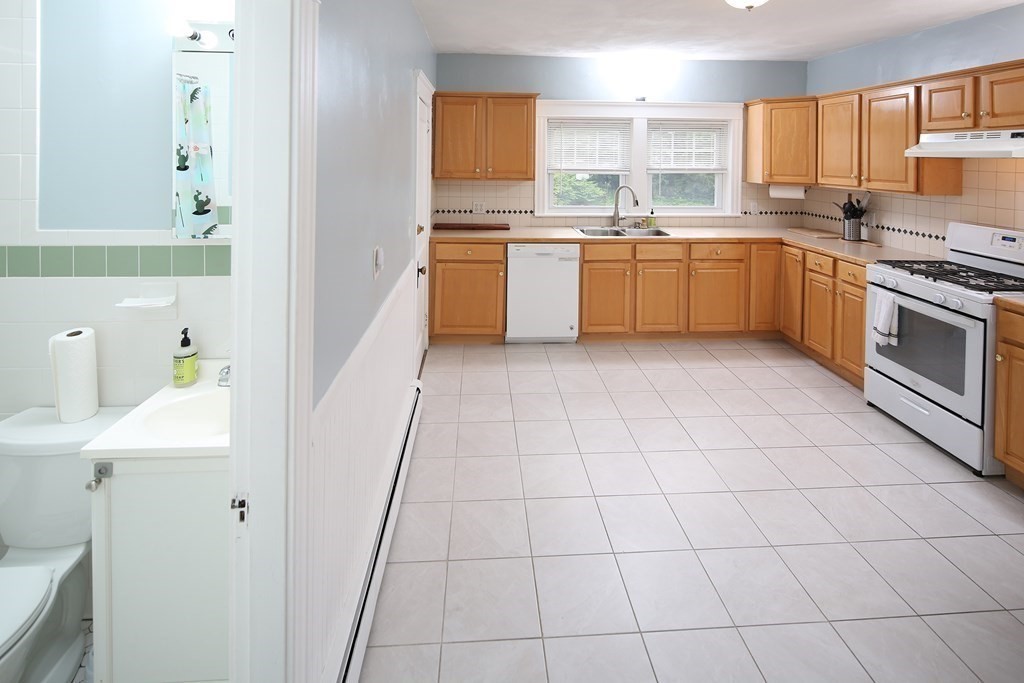 137 Mendon Road Attleboro, MA 02703 - Photo 8 of 24 a kitchen with stainless steel appliances granite countertop a sink and cabinets