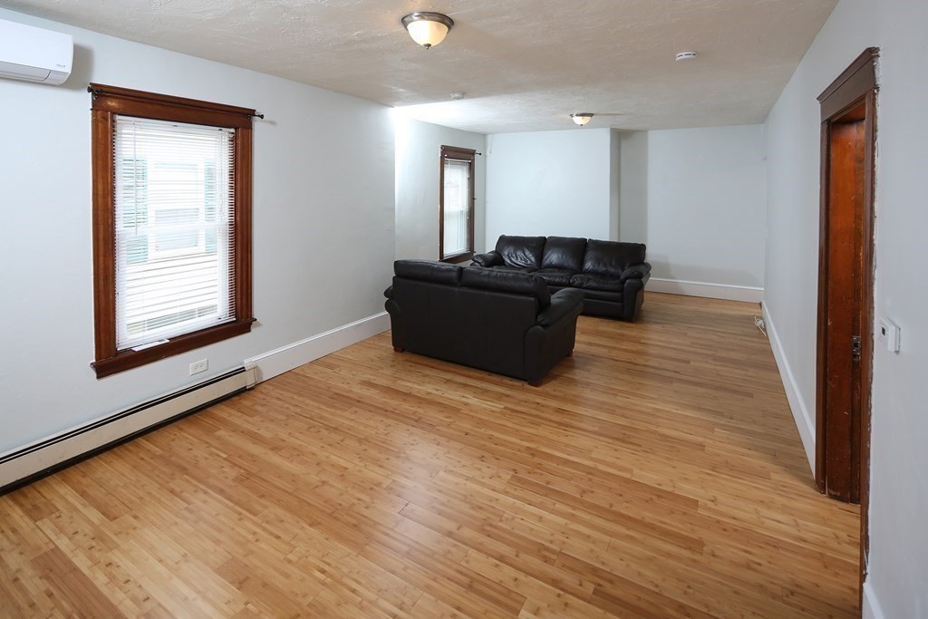 137 Mendon Road Attleboro, MA 02703 - Photo 9 of 24 a living room with a couch and a window