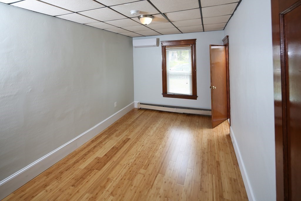 137 Mendon Road Attleboro, MA 02703 - Photo 10 of 24 a view of empty room with wooden floor and fan