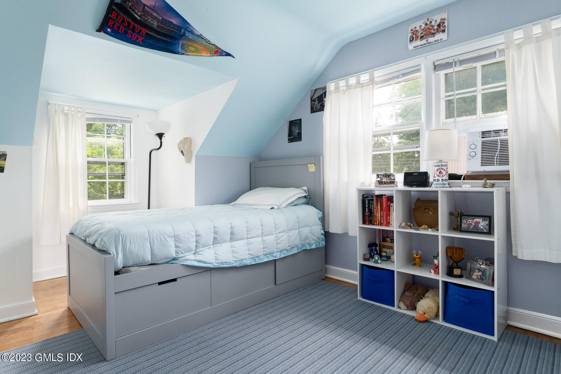 7 Wilmot Lane Riverside, CT 06878 - Photo 12 of 22 a bedroom with a bed and a large window