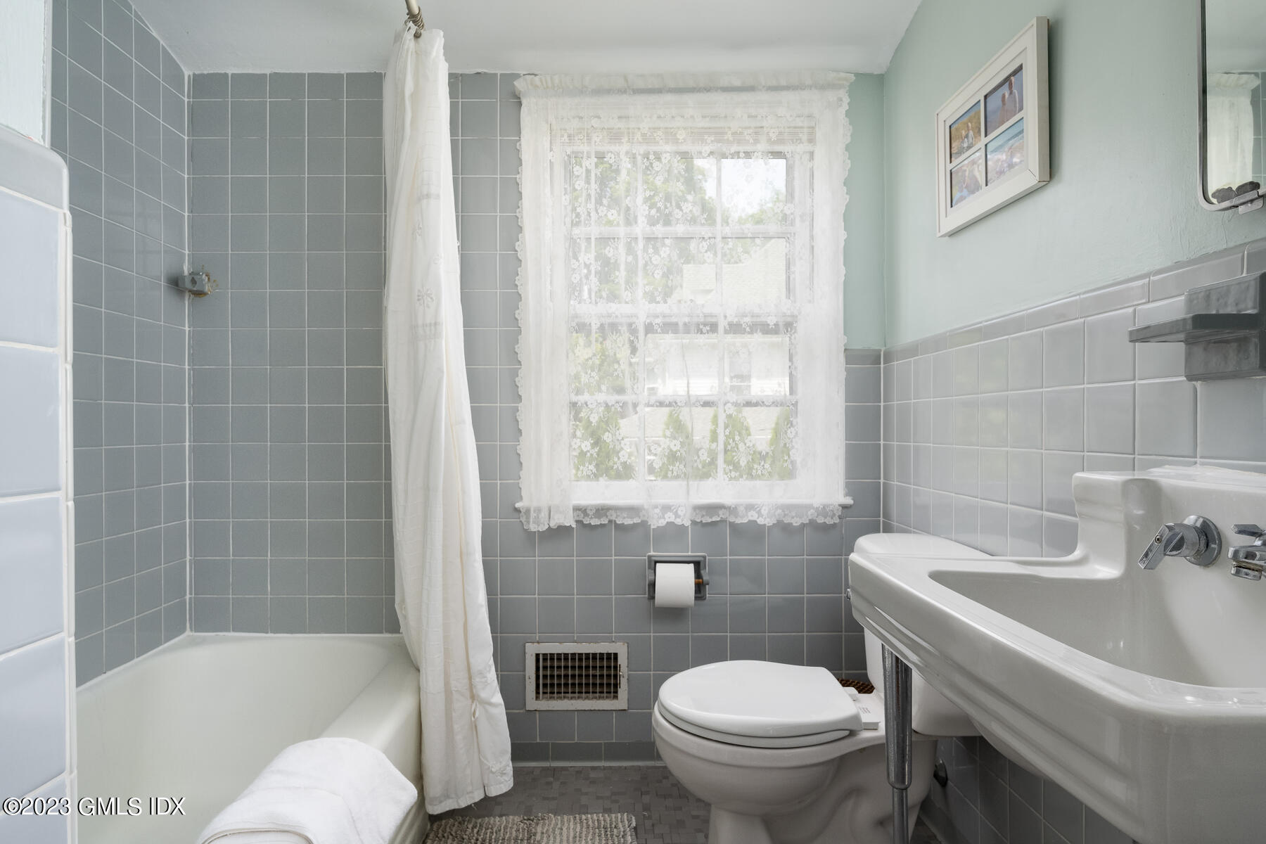 7 Wilmot Lane Riverside, CT 06878 - Photo 13 of 22 a white toilet sitting next to a bath tub