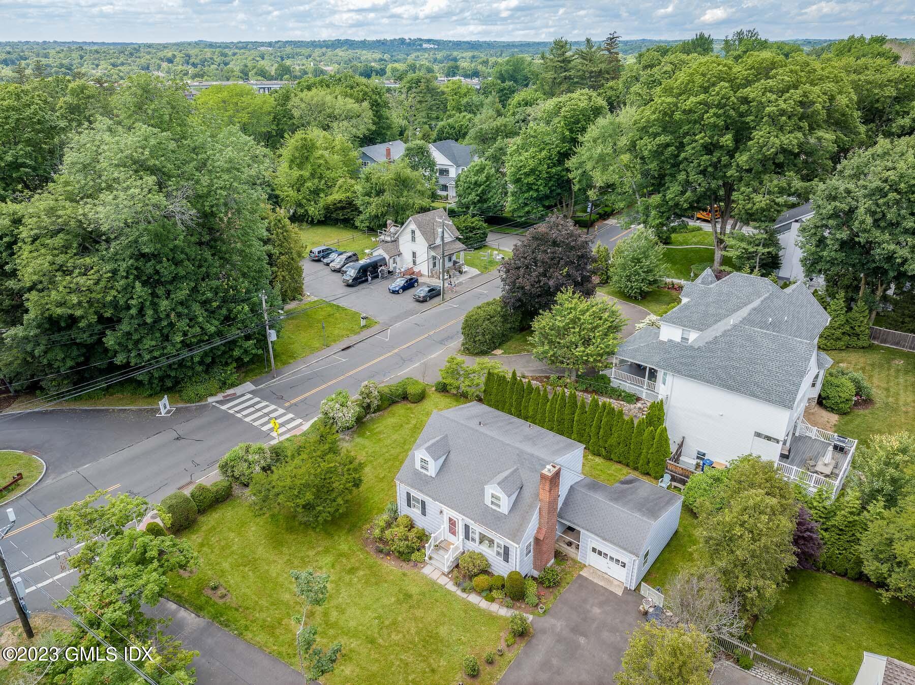7 Wilmot Lane Riverside, CT 06878 - Photo 16 of 22 an aerial view of a house with a garden and swimming pool