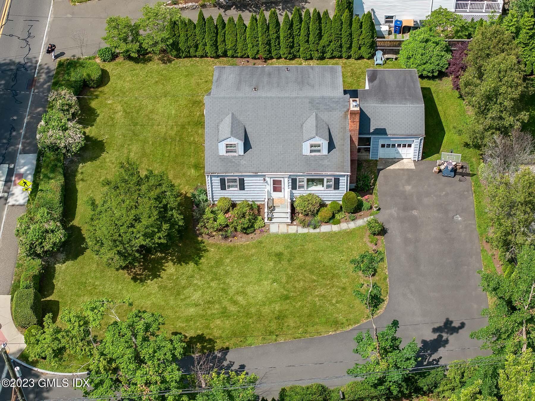 7 Wilmot Lane Riverside, CT 06878 - Photo 5 of 22 an aerial view of a house with garden space and lake view