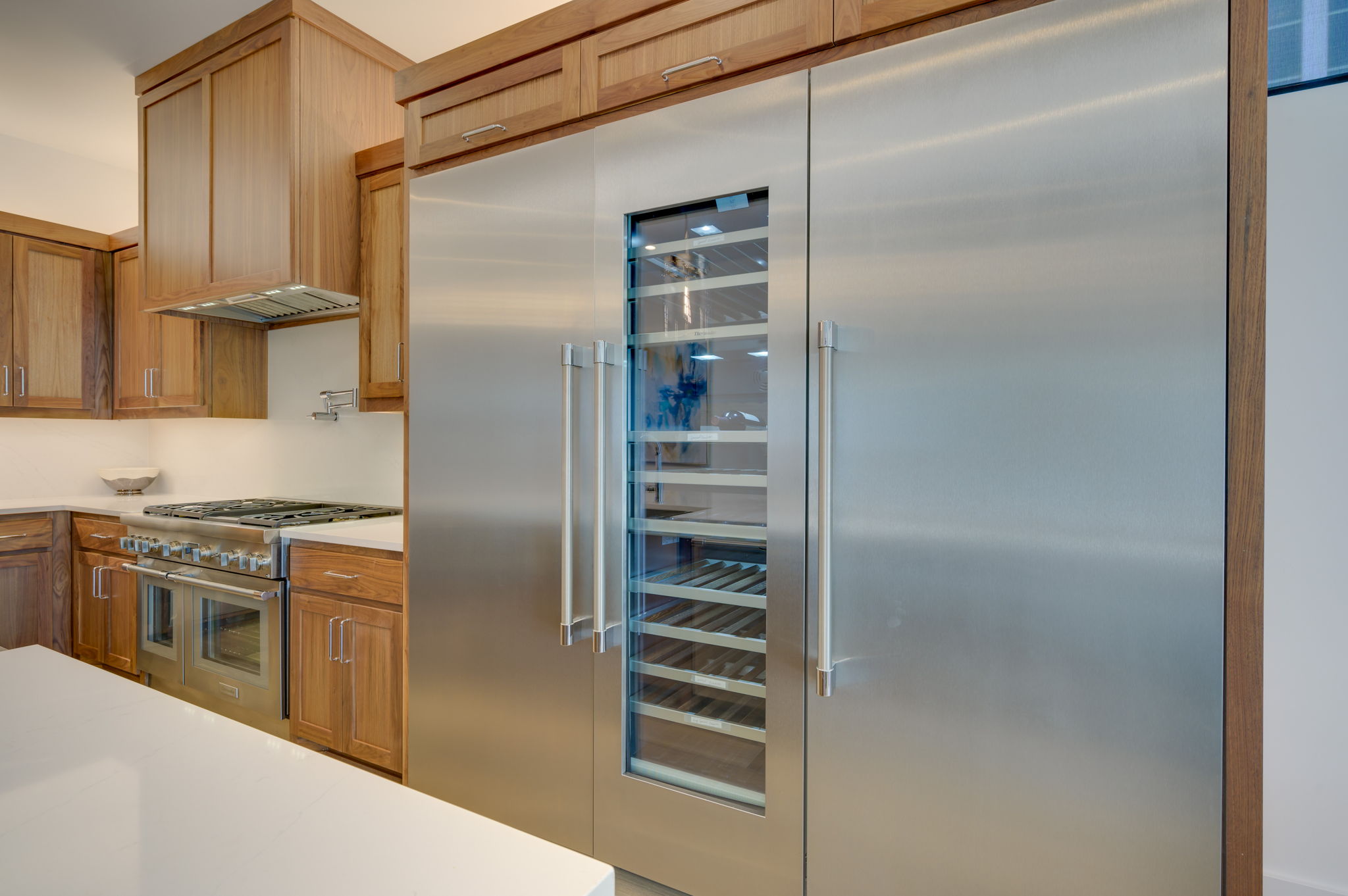 2415 McCall Road Austin, TX 78703 - Photo 12 of 40 Culinary excellence awaits in this kitchen featuring a stainless steel gas range and a built-in wine cooler.