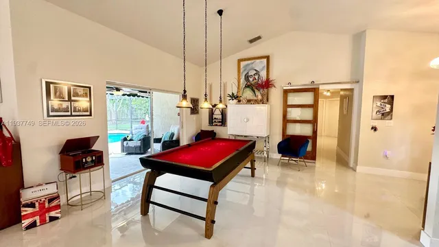 a living room with furniture a rug and white walls