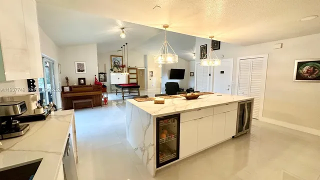 a view of kitchen and sink