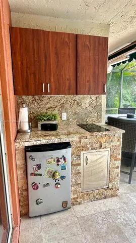 a kitchen with a stove and a cabinet