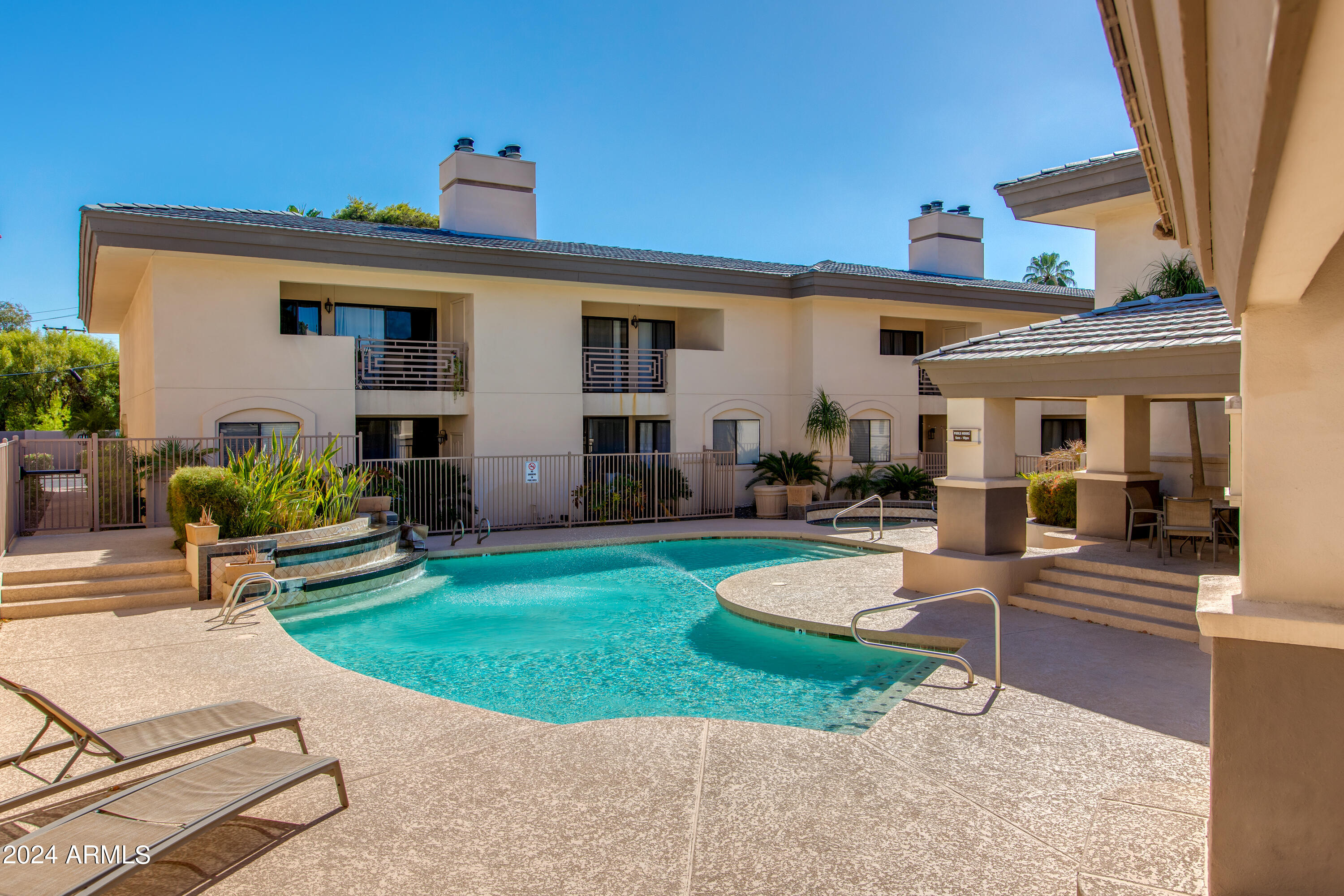 3235 East Camelback Road, Unit 118 Phoenix, AZ 85018 - Photo 12 of 12 a view of a house with a patio