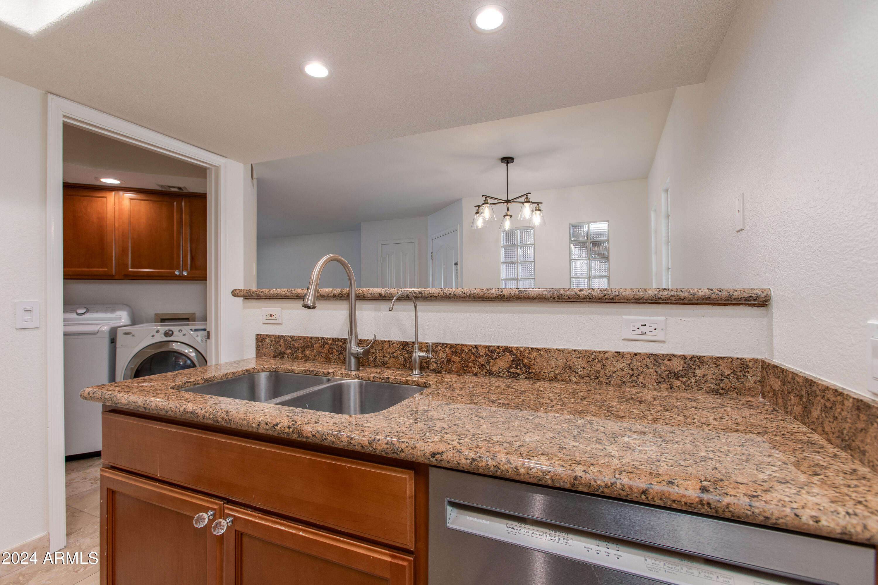 3235 East Camelback Road, Unit 118 Phoenix, AZ 85018 - Photo 5 of 12 a view of a kitchen counter top space and cabinets