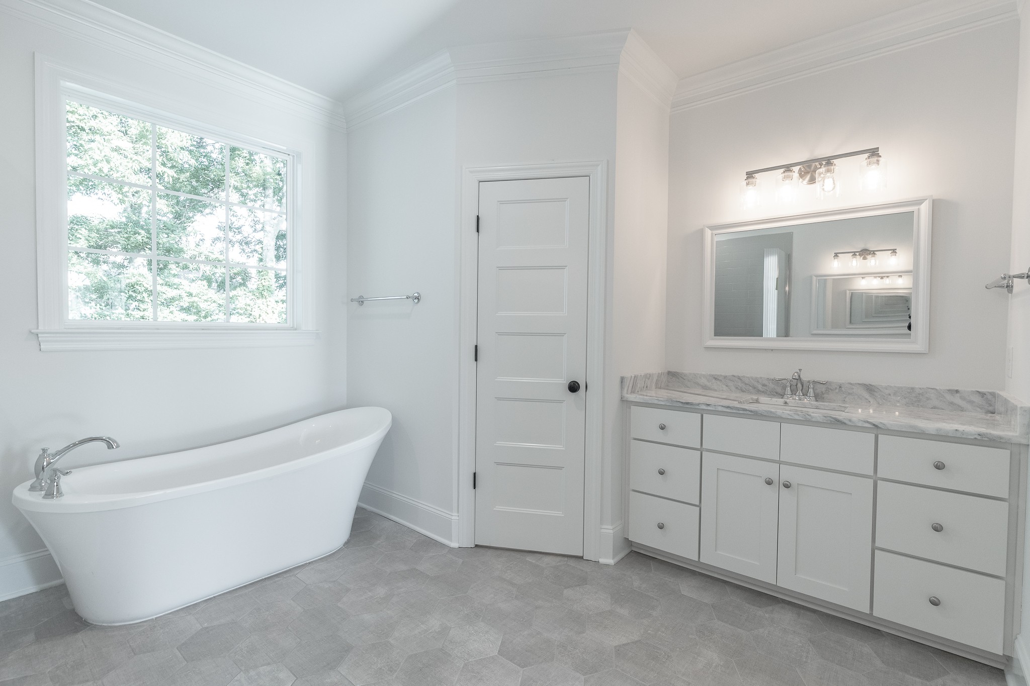 6048 Kidman Lane Spring Hill, TN 37174 - Photo 11 of 31 a spacious bathroom with a tub sink and mirror