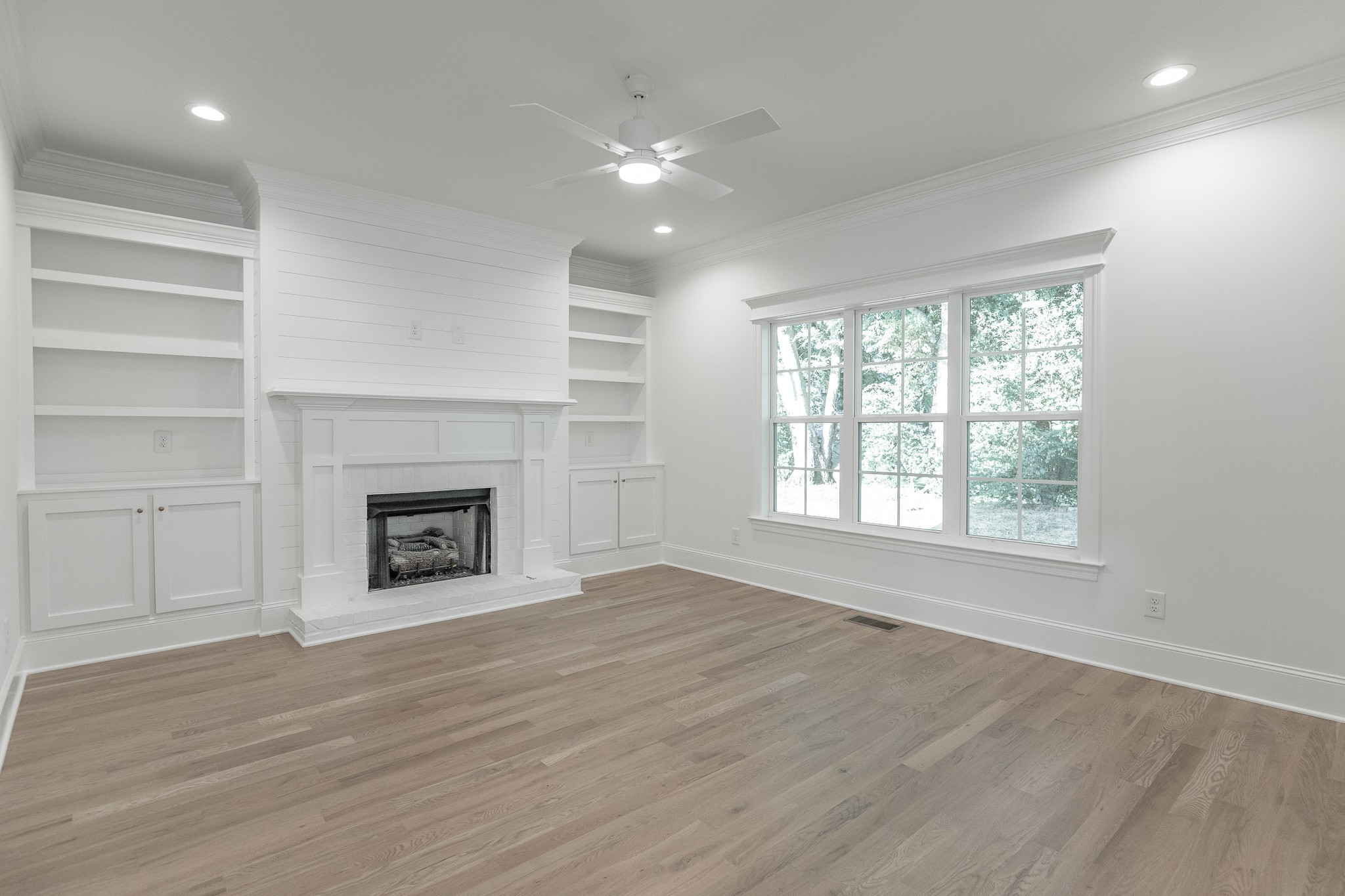 6048 Kidman Lane Spring Hill, TN 37174 - Photo 15 of 31 an empty room with windows and fireplace