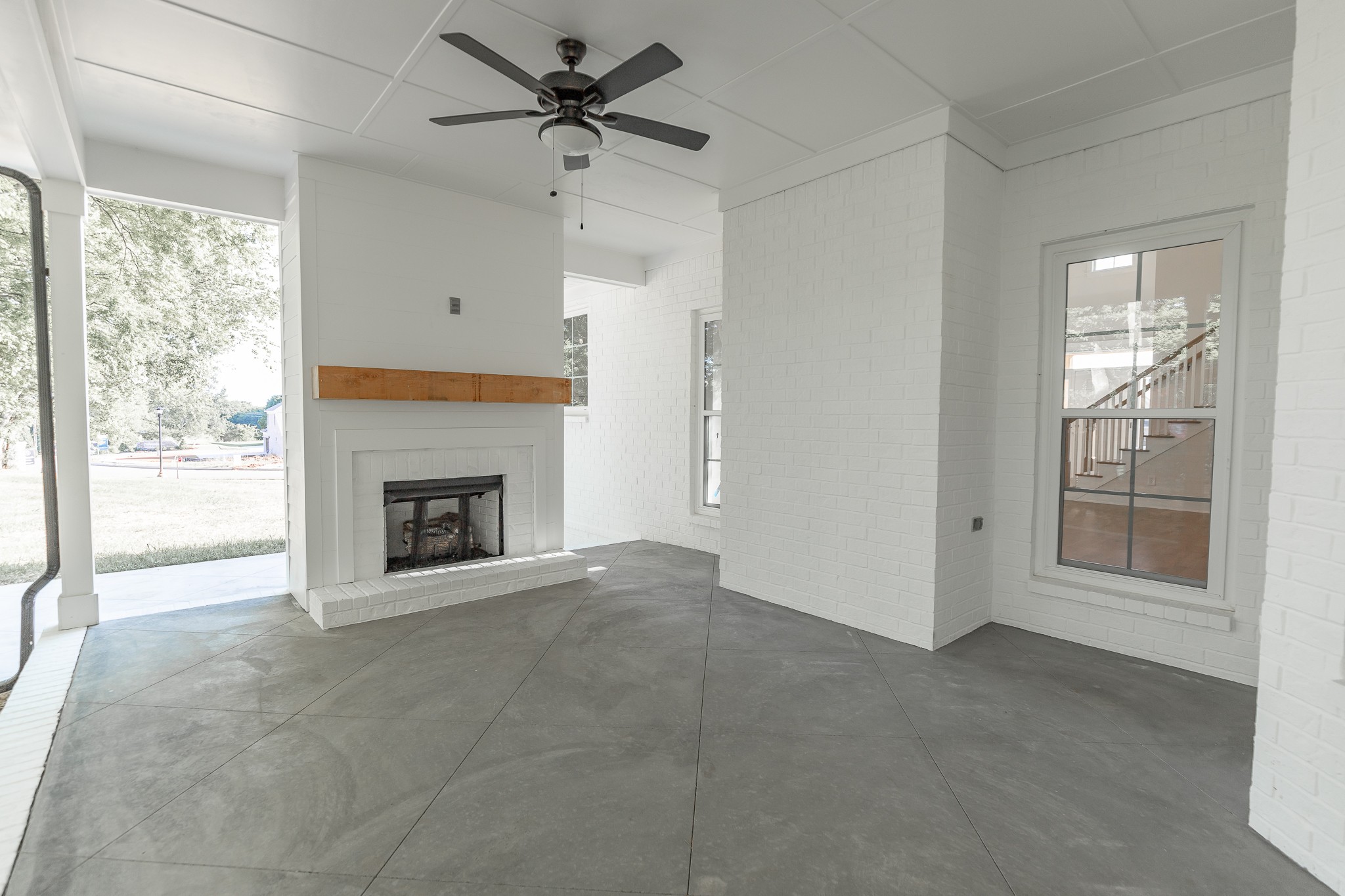 6048 Kidman Lane Spring Hill, TN 37174 - Photo 16 of 31 a view of an empty room with a fireplace and a window
