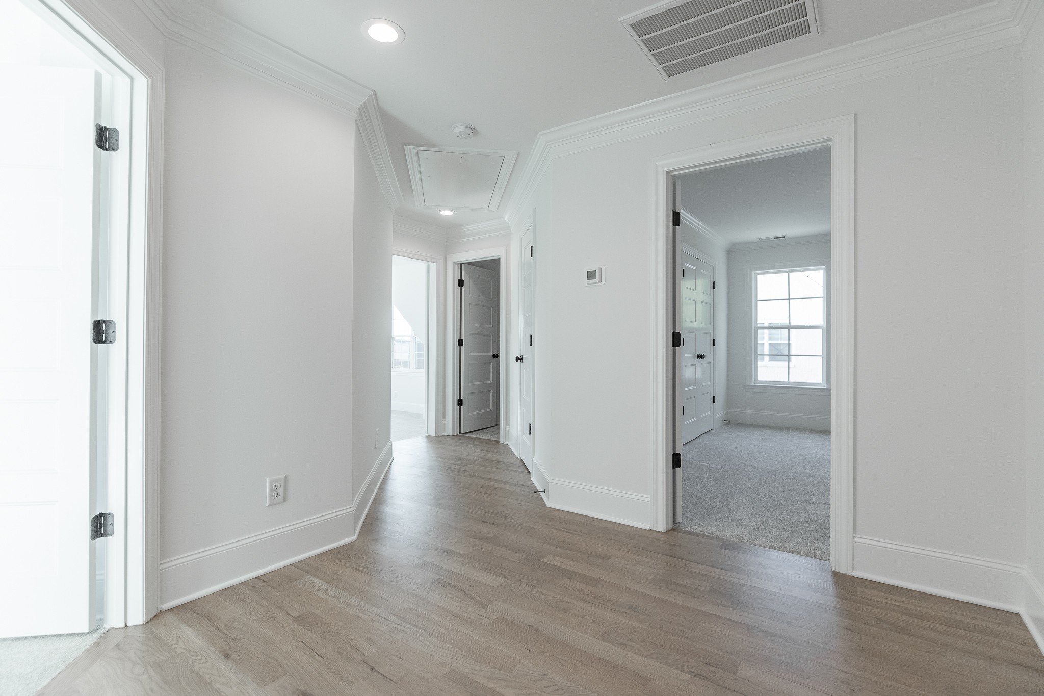 6048 Kidman Lane Spring Hill, TN 37174 - Photo 21 of 31 a view of a hallway with wooden floor