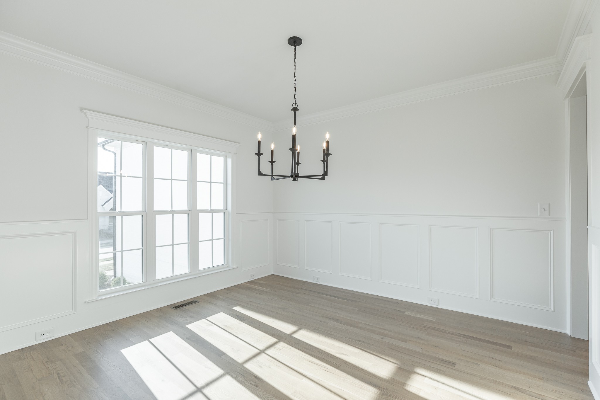 6048 Kidman Lane Spring Hill, TN 37174 - Photo 4 of 31 a view of an empty room with wooden floor and a window