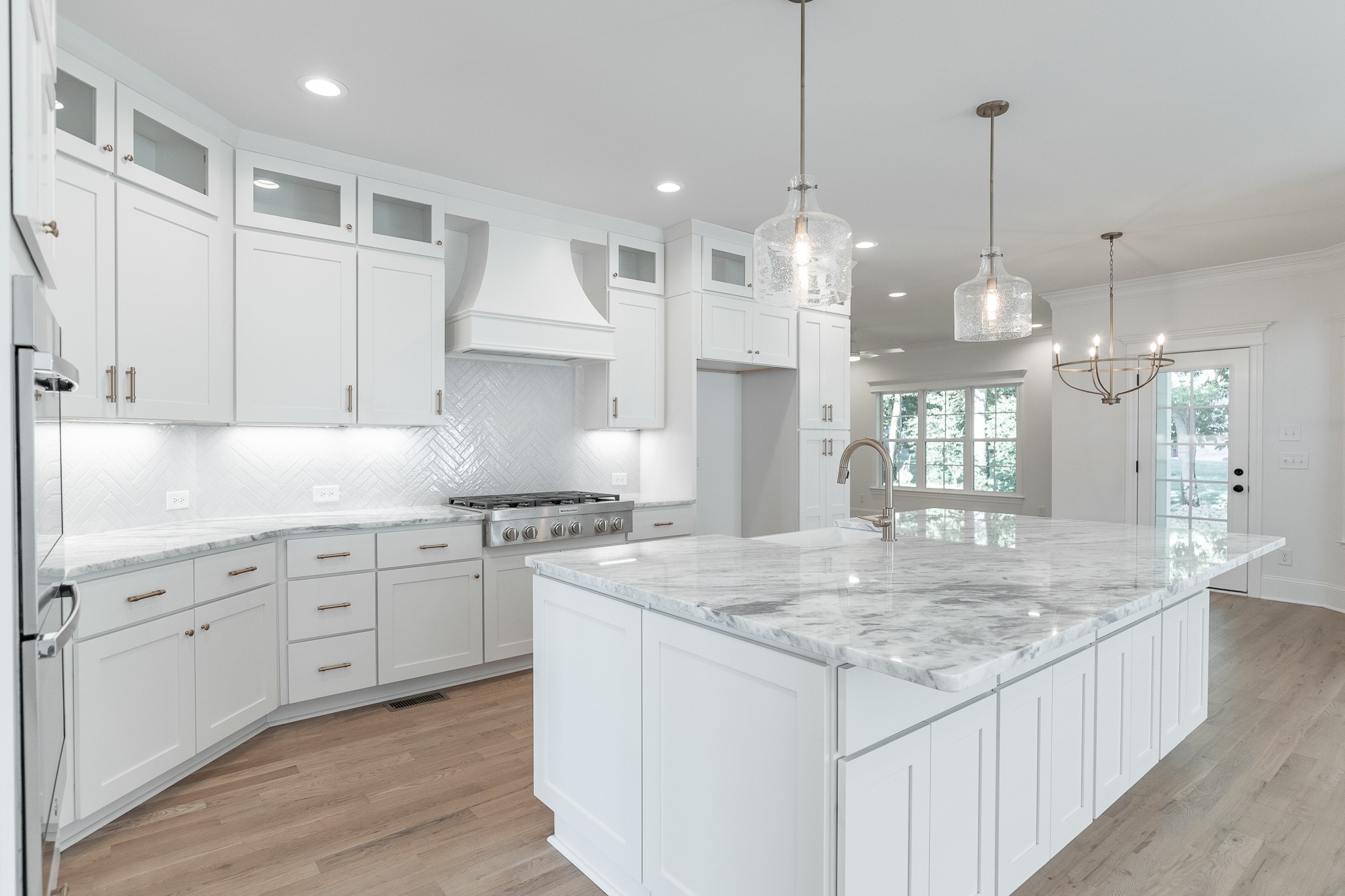 6048 Kidman Lane Spring Hill, TN 37174 - Photo 5 of 31 a kitchen with stainless steel appliances granite countertop stove top oven and cabinets