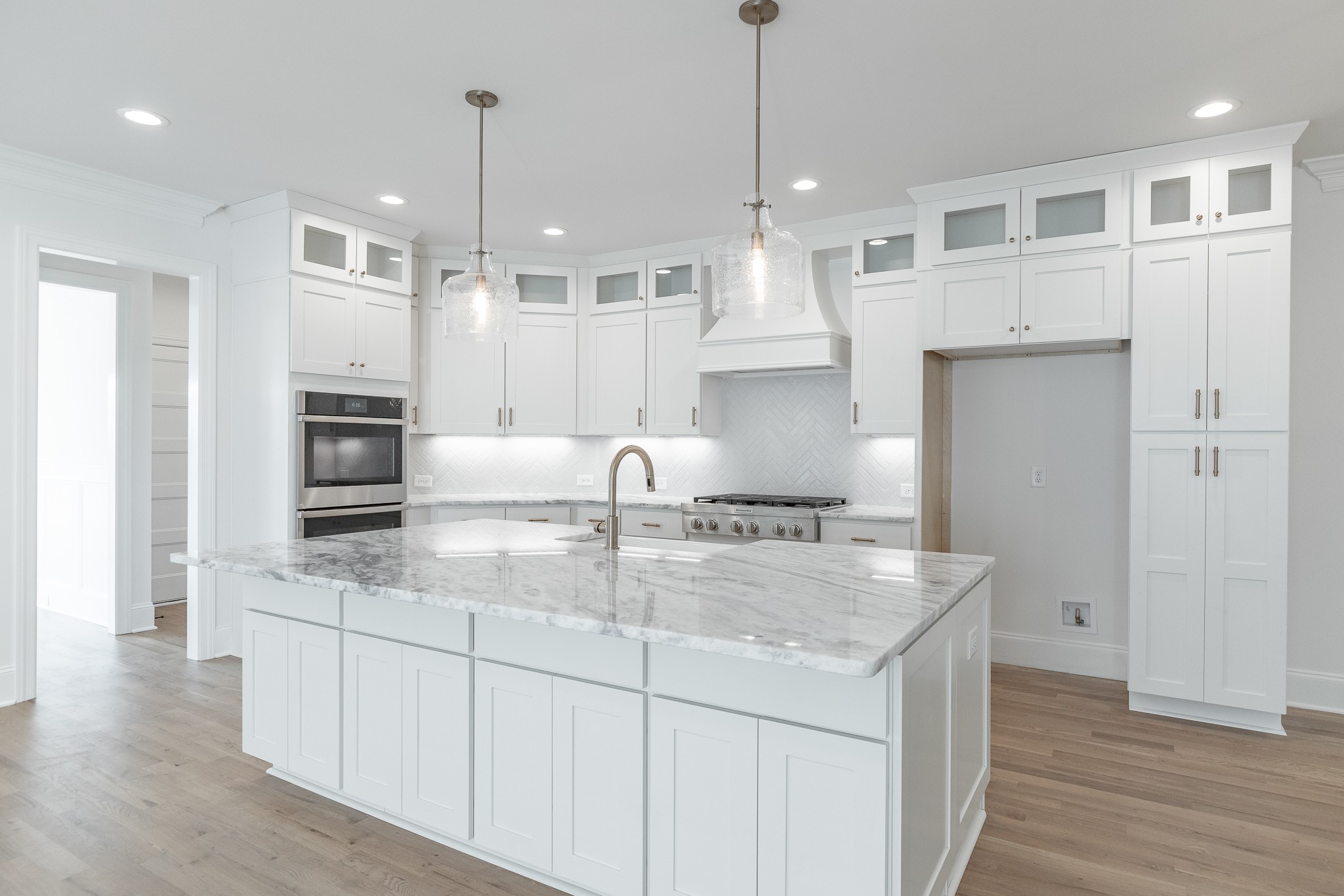 6048 Kidman Lane Spring Hill, TN 37174 - Photo 6 of 31 a kitchen with stainless steel appliances granite countertop a sink a refrigerator and a stove