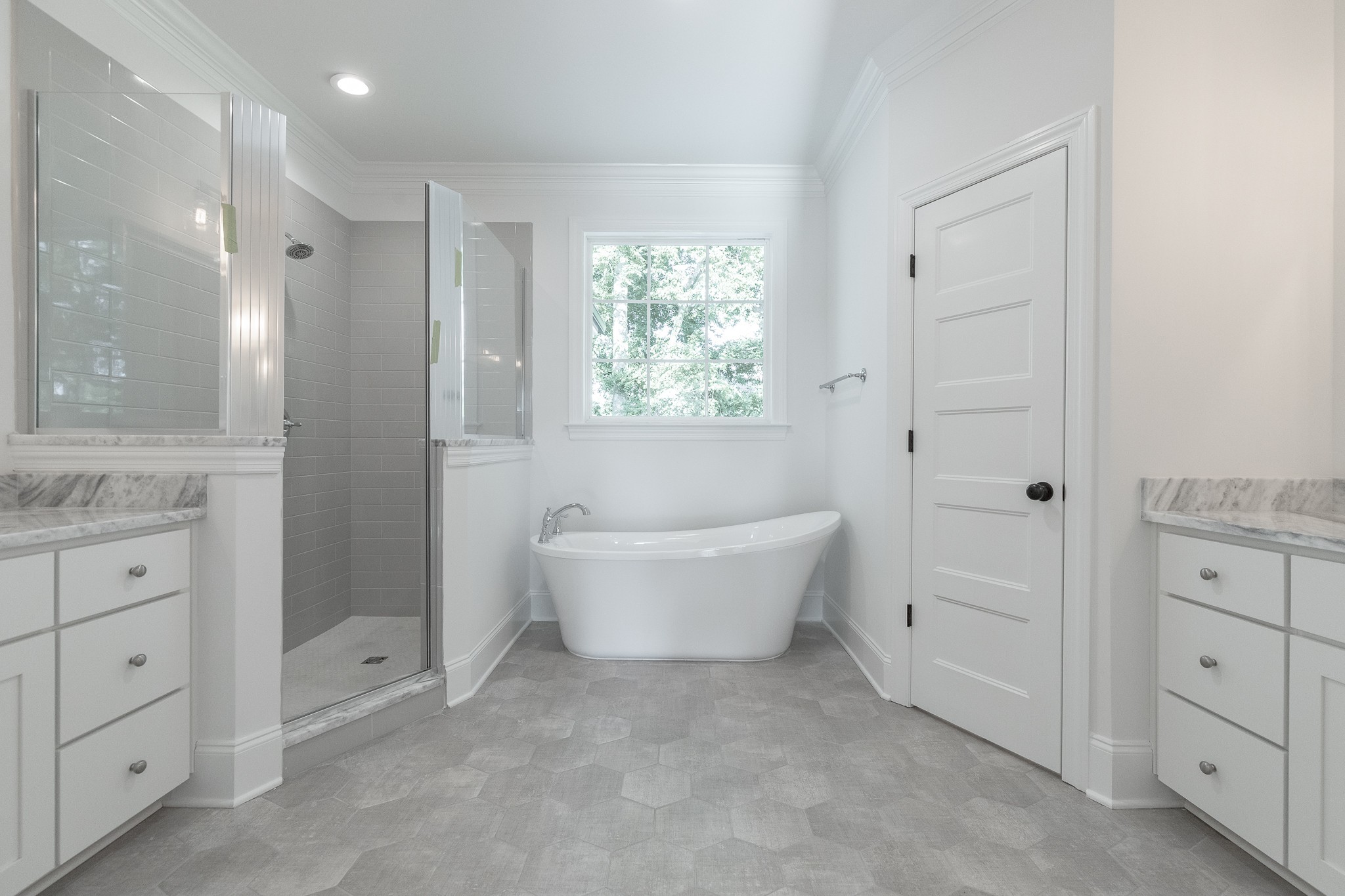 6048 Kidman Lane Spring Hill, TN 37174 - Photo 10 of 31 a bathroom with a bathtub a sink and a window