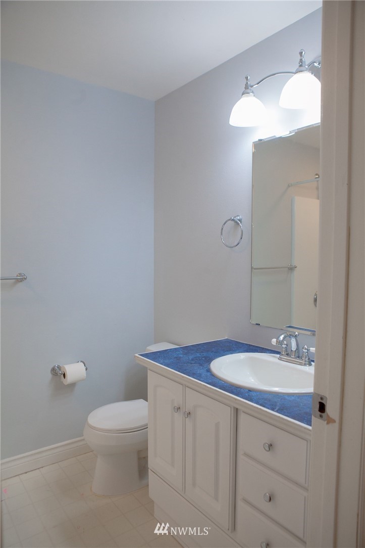 2721 167th Street Southeast Bothell, WA 98012 - Photo 14 of 18 a bathroom with a sink a toilet and mirror