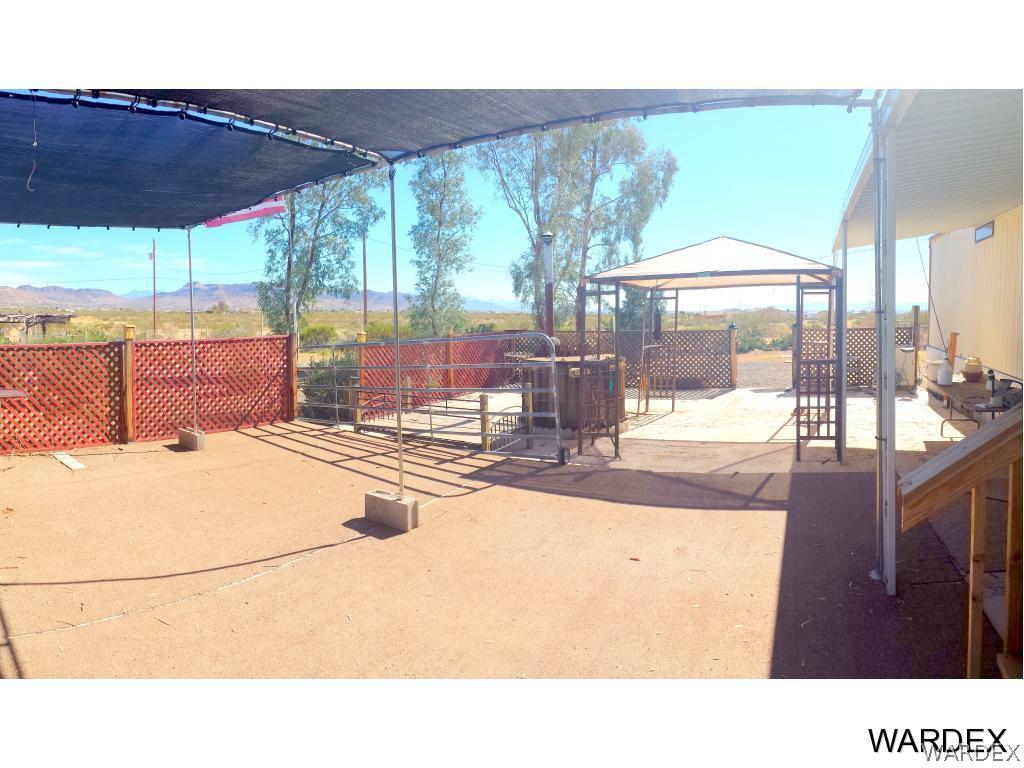 3865 Aztec Road Golden Valley, AZ 86413 - Photo 15 of 26 a outdoor living space with furniture