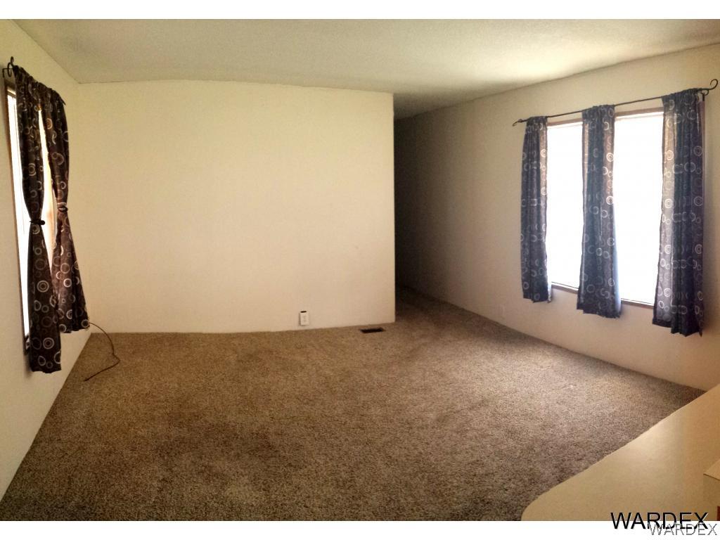 3865 Aztec Road Golden Valley, AZ 86413 - Photo 8 of 26 a view of an empty room and window