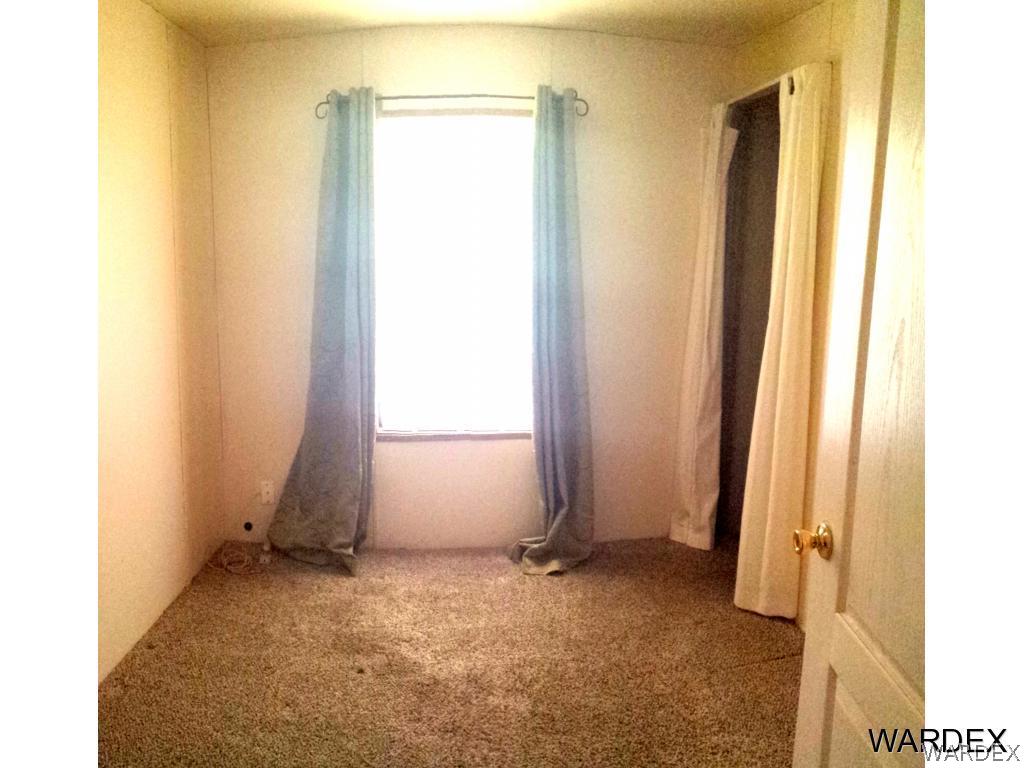 3865 Aztec Road Golden Valley, AZ 86413 - Photo 9 of 26 a view of room with window