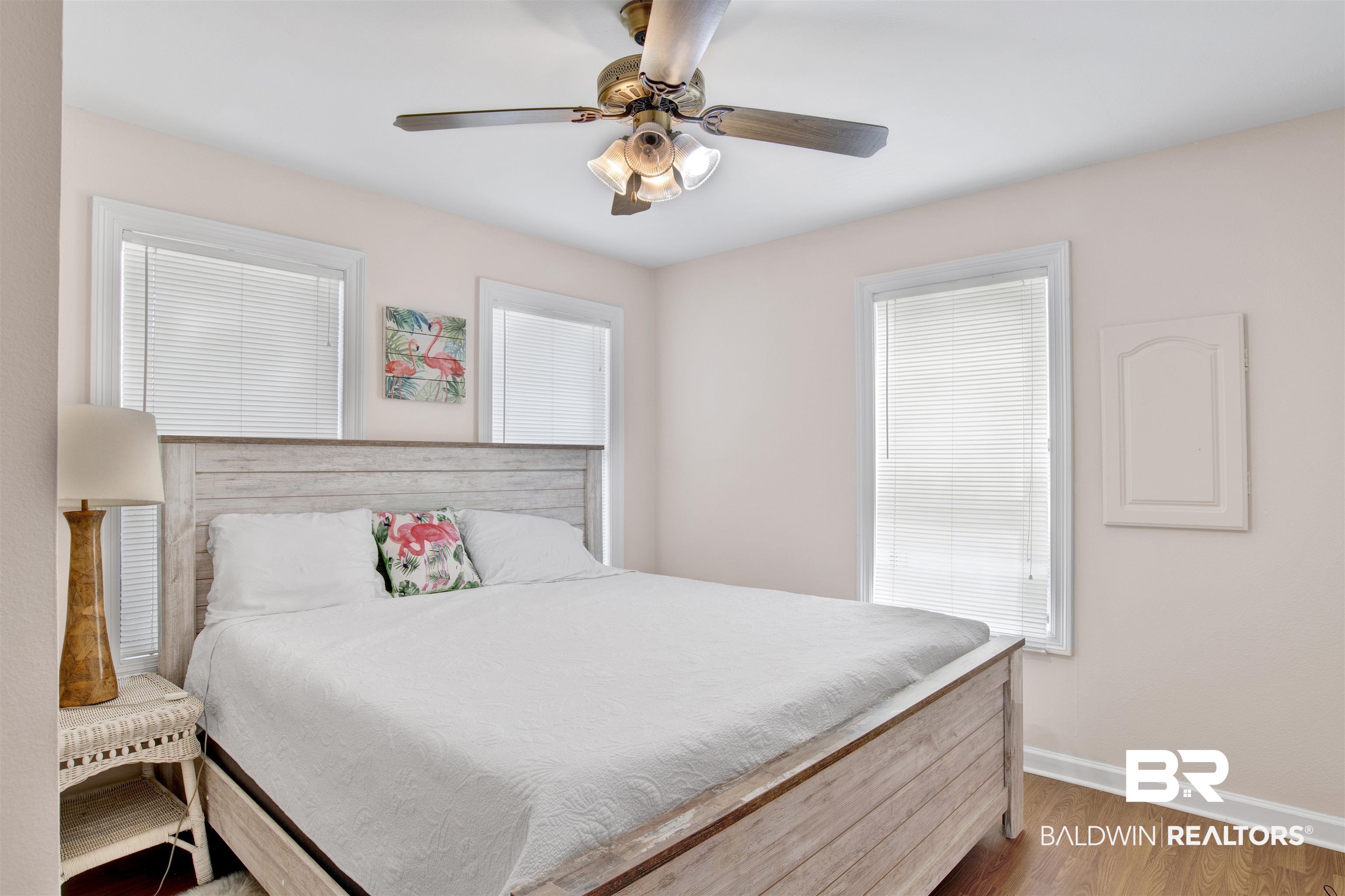 33093 River Road Orange Beach, AL 36561 - Photo 24 of 30 Bedroom featuring multiple windows, ceiling fan, and hardwood / wood-style floors