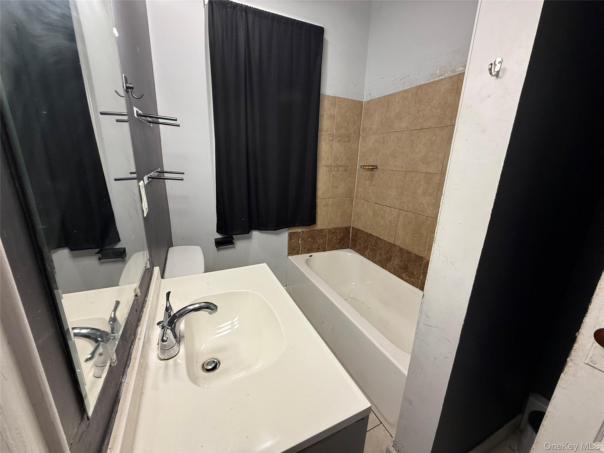 115 Innis Avenue Poughkeepsie, NY 12601 - Photo 14 of 28 Bathroom featuring a bath and vanity