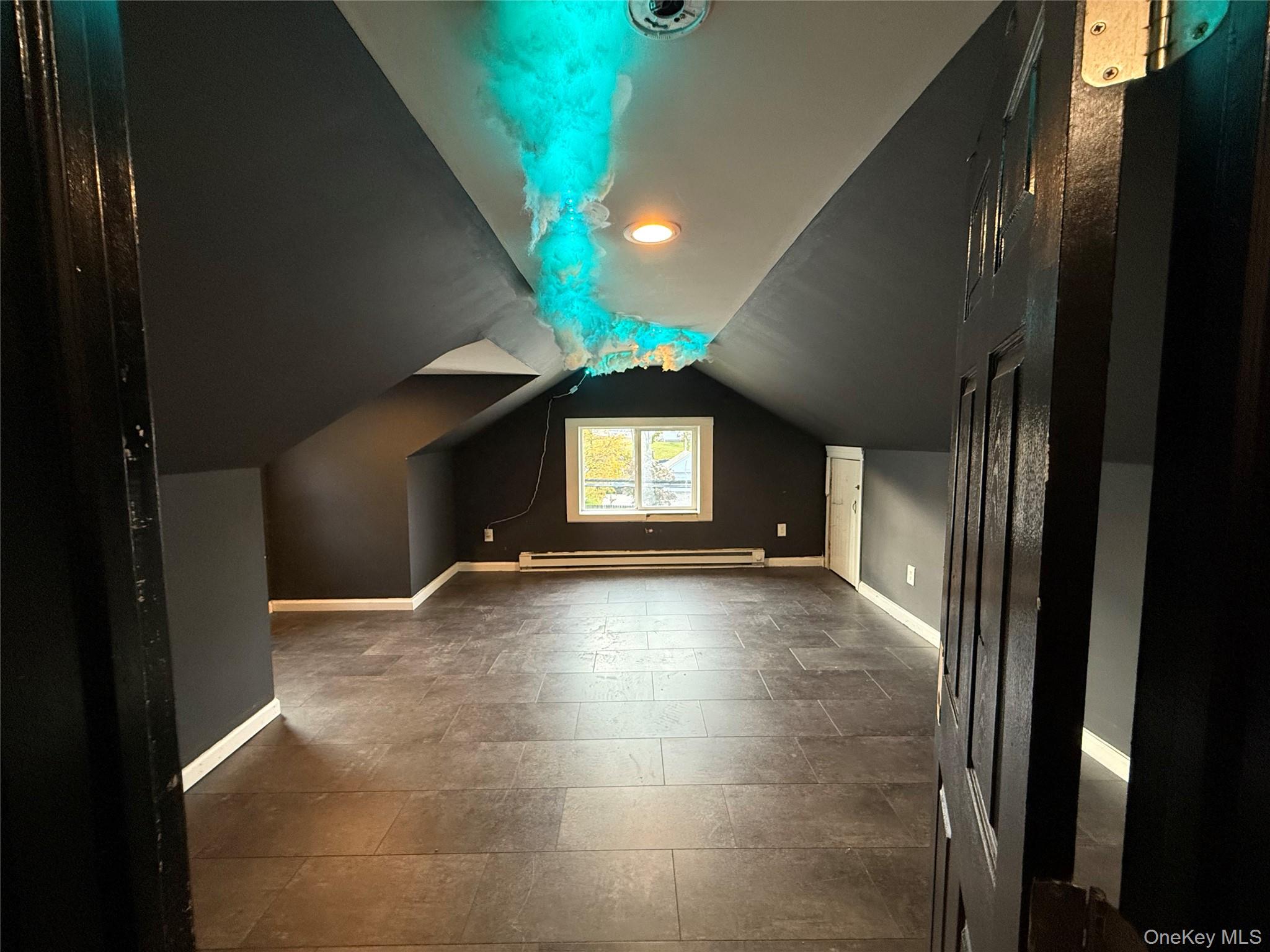 115 Innis Avenue Poughkeepsie, NY 12601 - Photo 27 of 28 Featuring vaulted ceiling and a baseboard radiator