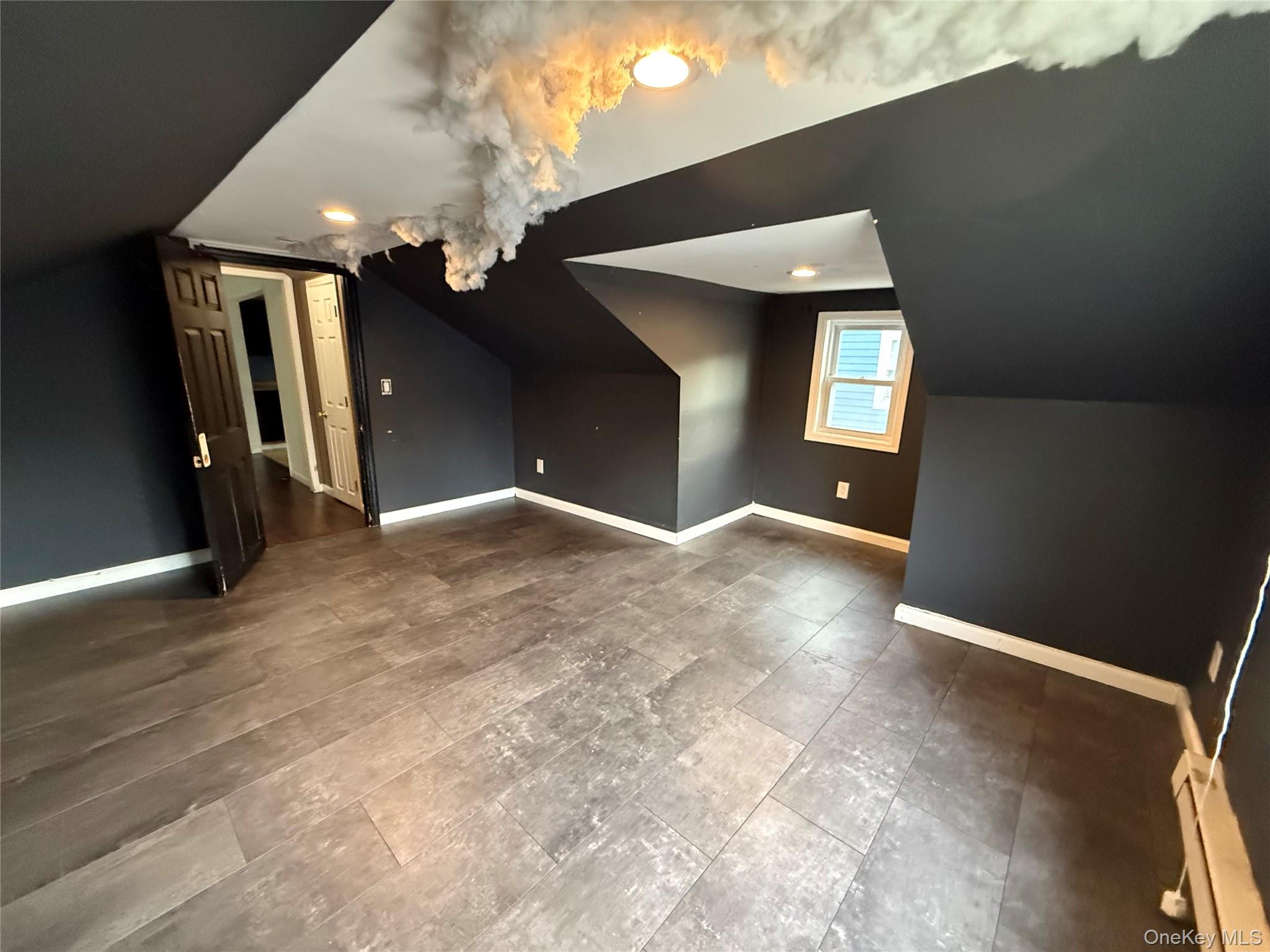 115 Innis Avenue Poughkeepsie, NY 12601 - Photo 28 of 28 Additional living space with vaulted ceiling and a baseboard heating unit