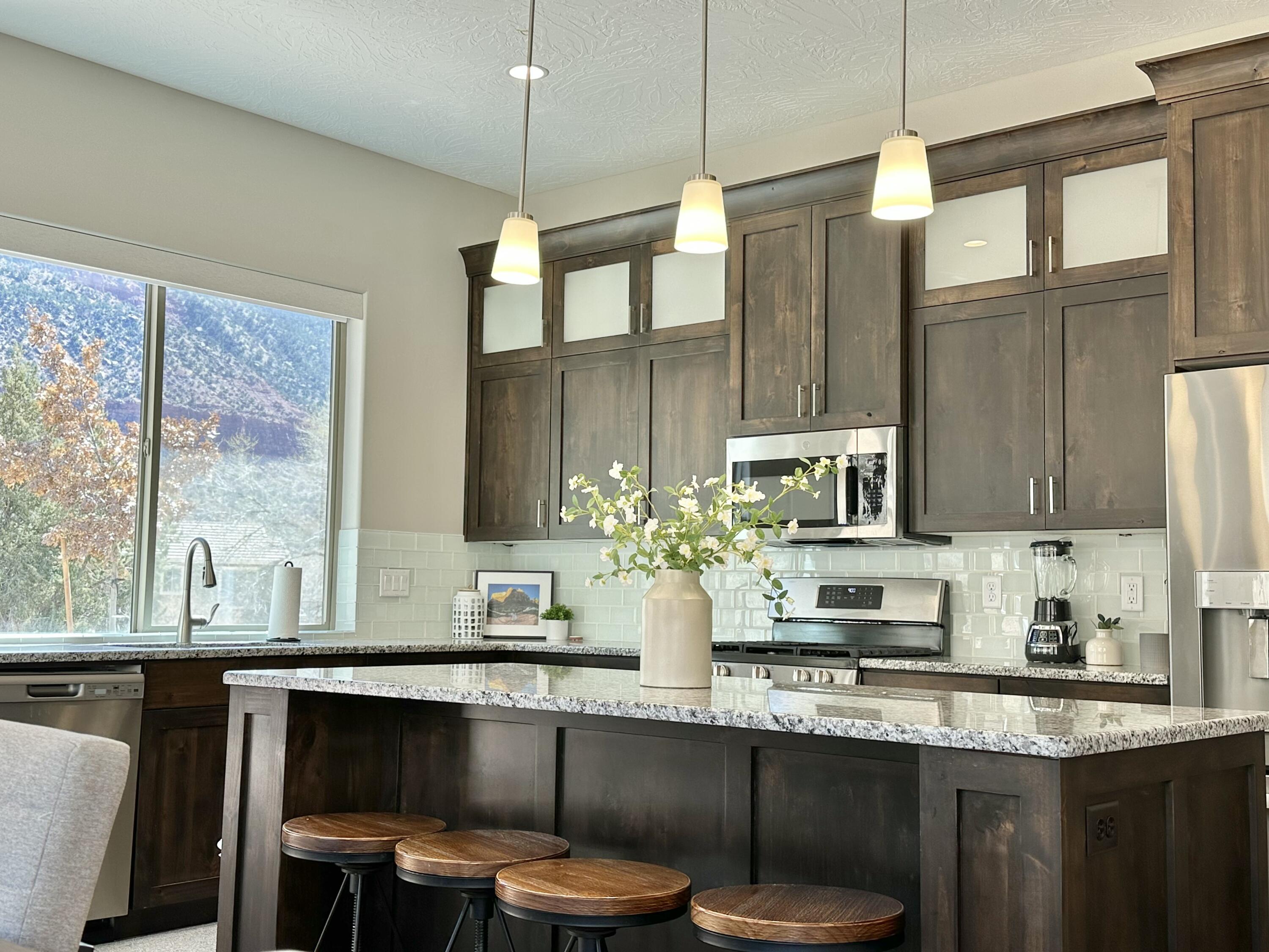 108 Trapper Circle, Unit C Springdale, UT 84767 - Photo 12 of 29 Tile Backsplash & Glass Cabinet Door