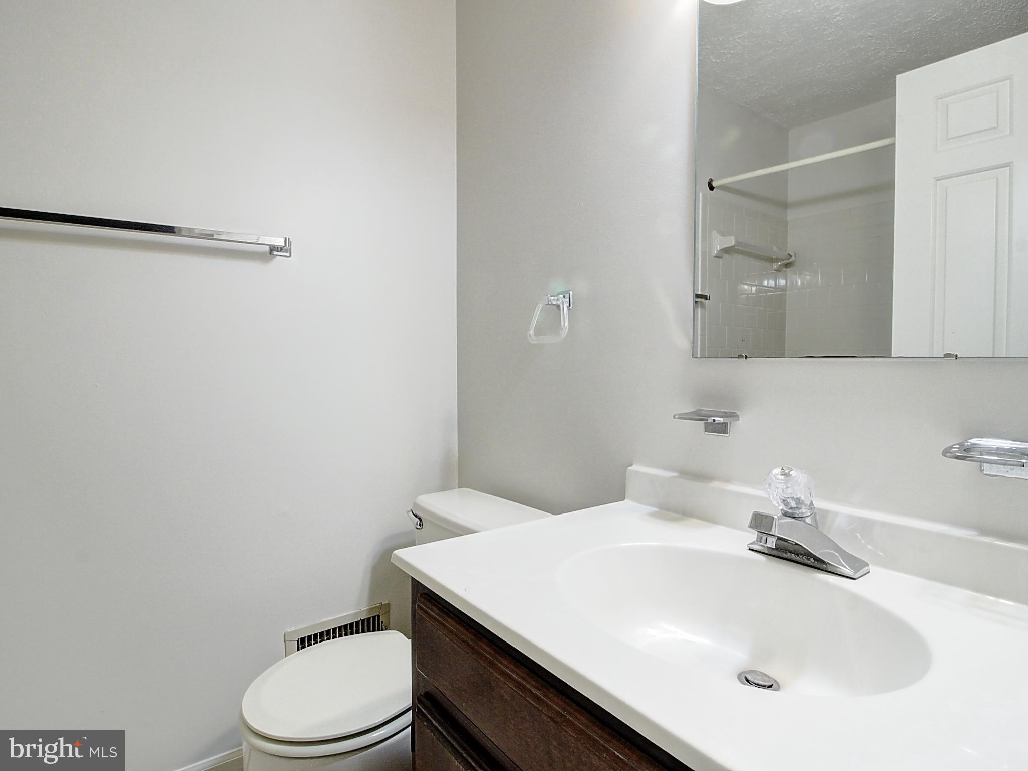 7990 Quay Court Frederick, MD 21701 - Photo 16 of 16 a bathroom with a sink toilet and vanity