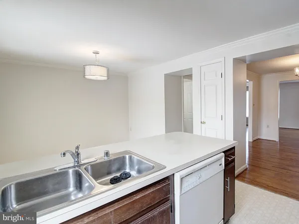 a view white cabinets and sink