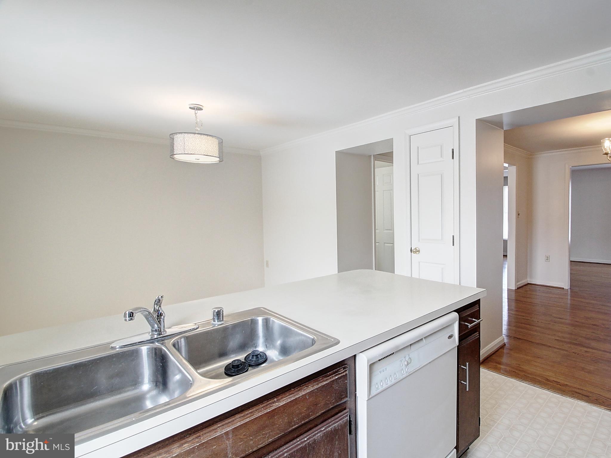 7990 Quay Court Frederick, MD 21701 - Photo 4 of 16 a view white cabinets and sink