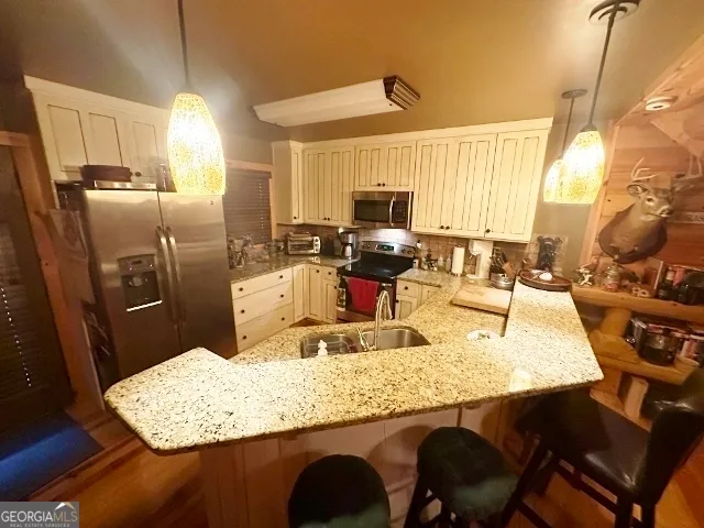 a dining table with chairs and chandelier