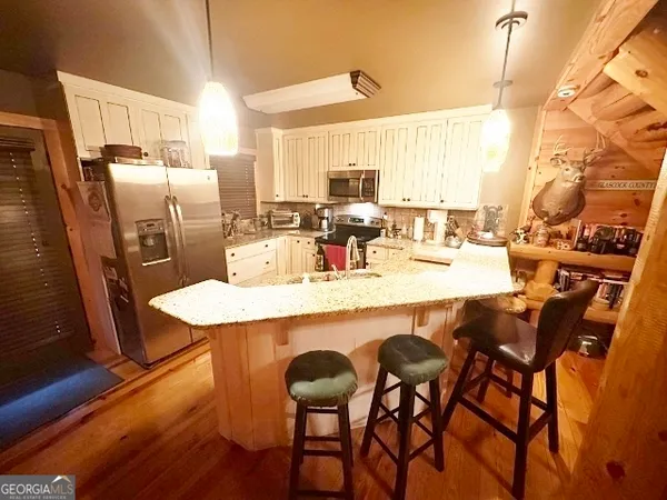 a bedroom with a bed and flat screen tv
