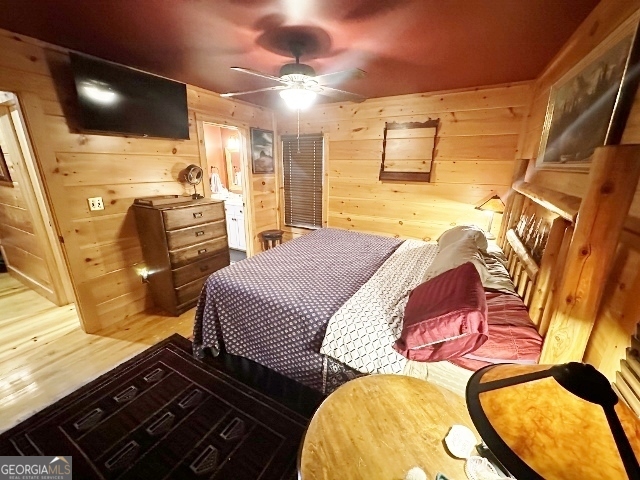 5559 Mill Creek Church Road Mitchell, GA 30820 - Photo 16 of 65 a bedroom with a bed and flat screen tv