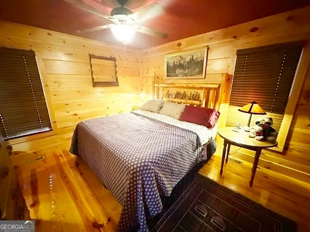 a view of a door with wooden floor and furniture