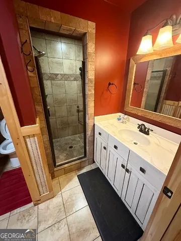 a living room with a couch and wooden floor