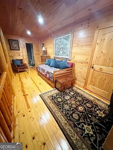 a bedroom with double bed and a window