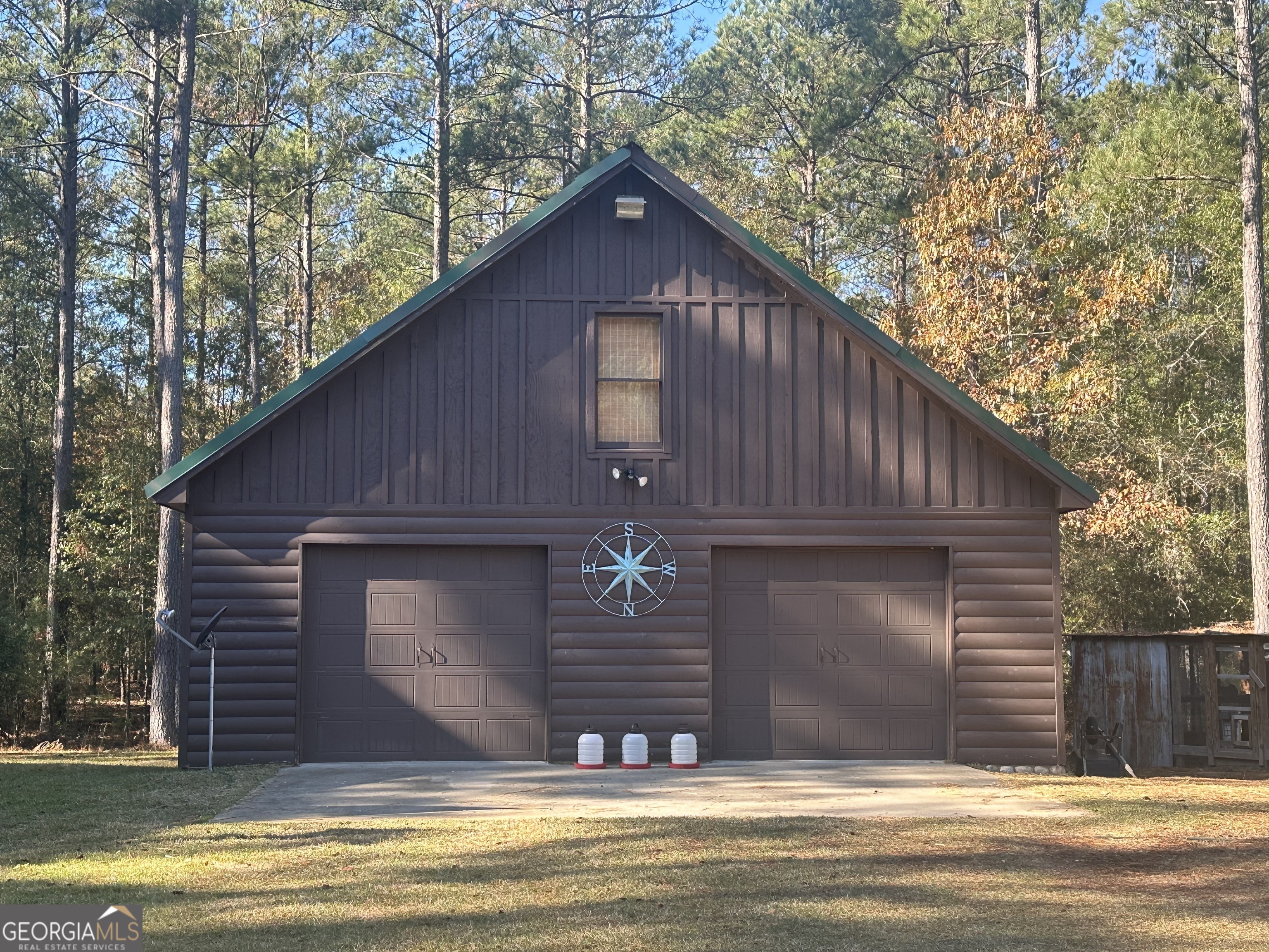 5559 Mill Creek Church Road Mitchell, GA 30820 - Photo 34 of 65 a view of a house with a swimming pool