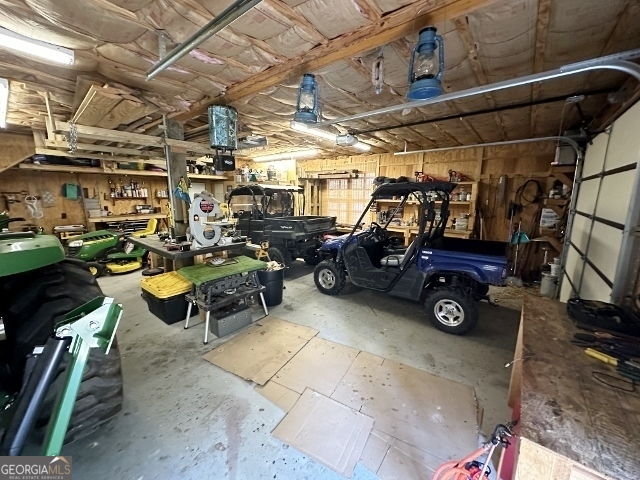 5559 Mill Creek Church Road Mitchell, GA 30820 - Photo 35 of 65 a view of a garage with cars