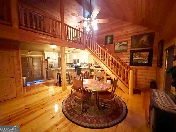 a view of entryway livingroom and hall with wooden floor