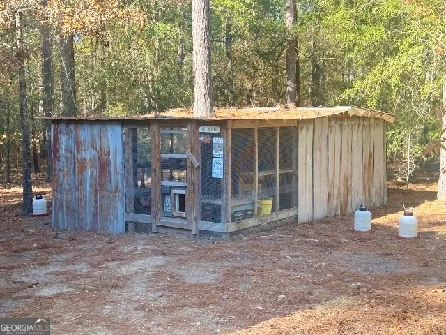 a view of a yard with large trees