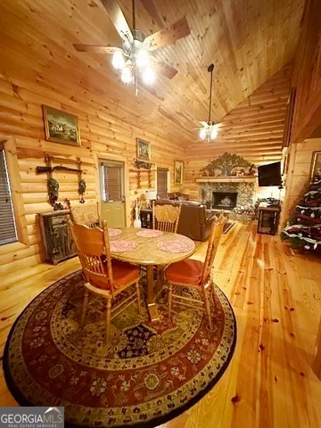 a view of a swimming pool with outdoor seating