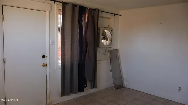 a bathroom with a shower and a door