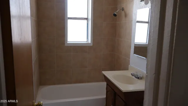 a bathroom with a sink toilet and tub