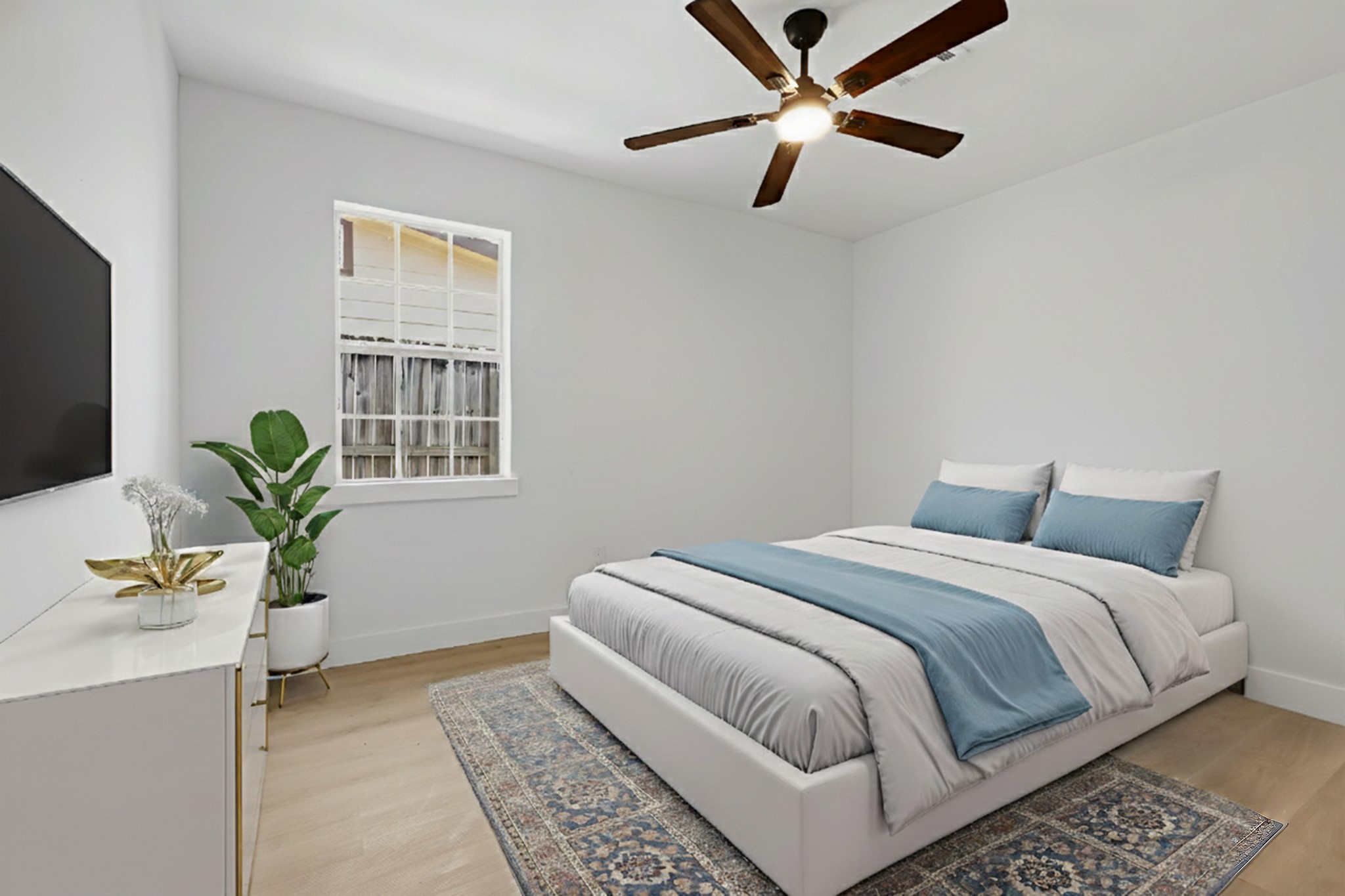 2716 Windsor Lane Pasadena, TX 77506 - Photo 13 of 22 a bedroom with a large bed and a potted plant