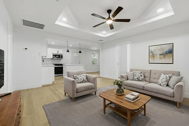 a kitchen with stainless steel appliances granite countertop a sink and a stove